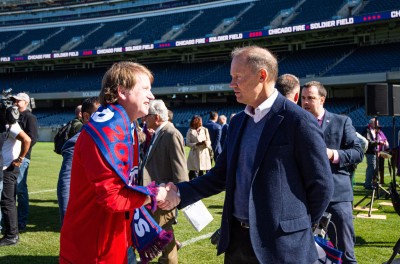 Joe Mansueto meets a Fire fan at Soldier Field, 2019.